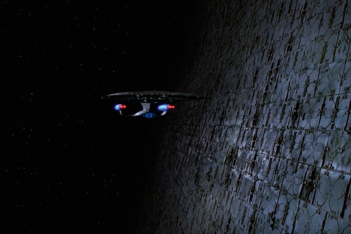 The starship Enterprise NCC 1701-D investigates a Dyson sphere then gets stuck inside