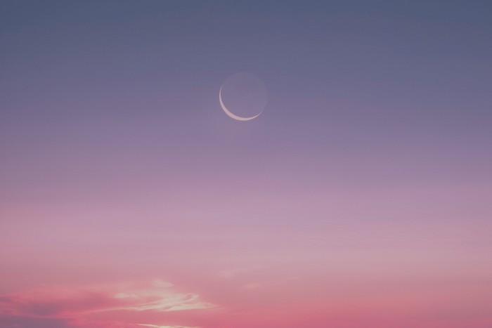 Earthshine in the early morning sky. Image by Getty images
