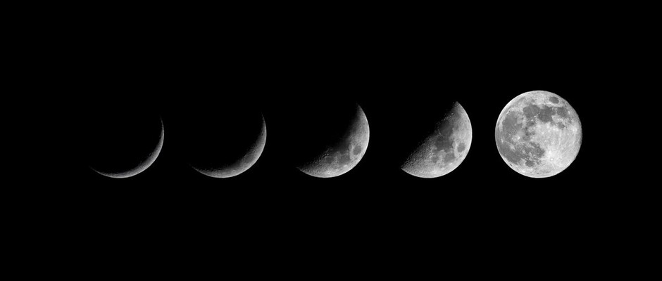 Lunar phases against dark sky