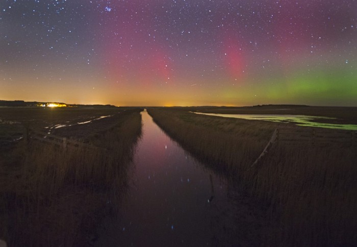 The Aurora Borealis lights up the sky over the north coast of Norfolk