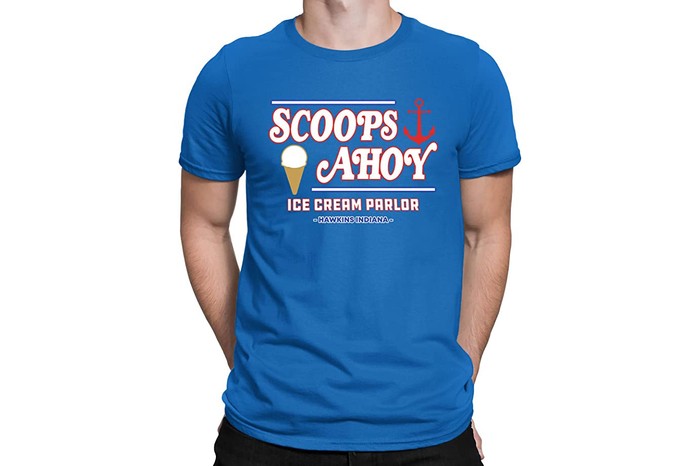 Man wearing Scoops Ahoy ice cream parlour t-shirt on a white background