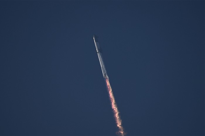 Rocket with flames flying upwards