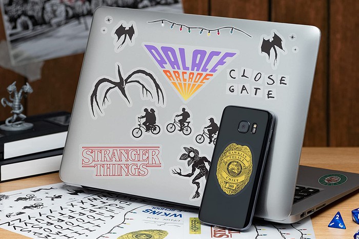 Stranger Things gadget decals on laptop and phone