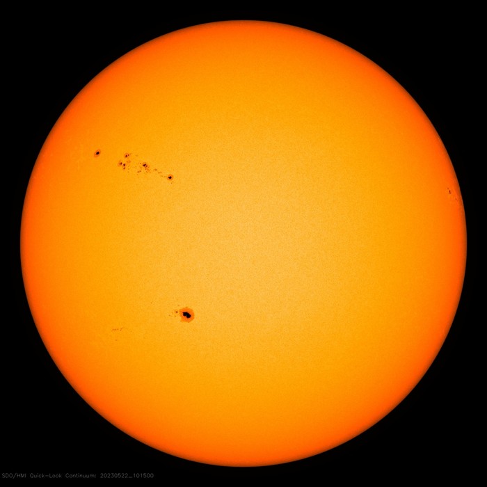 The Sun as it is in May 2023. You can just make out the black centre of the sunspots (the umbra) surrounded by a lighter, grey area (the penumbra) Image Credit: NASA