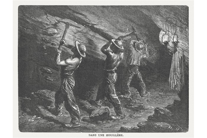 An antique engraving of workers in a coal mine.